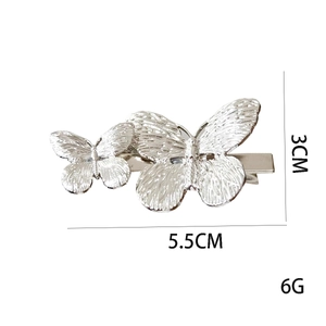 Detailed view of silver butterfly hair clip with precise 5.5cm by 3cm size measurements