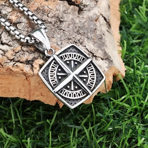 Retro stainless steel square compass pendant necklace on a natural wood and grass background