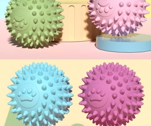 Detailed view of hollow TPR pet balls with footprint textures in four macaron colors