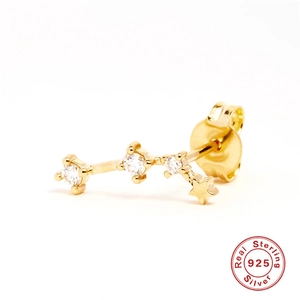 Detailed shot of S925 sterling silver gold-plated constellation stud earring with sparkling stones