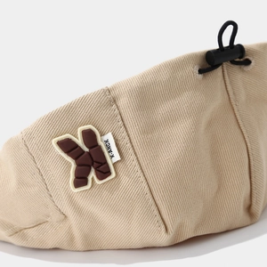 Kids minimalist camel beige beret hat featuring a unique 3D chocolate K letter and drawstring