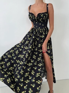 Close-up of lemon floral print on black corset dress with side slit and heart neckline
