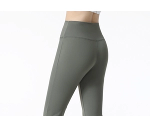 Detail of high-waisted olive green yoga pants showing tummy control and butt lifting effect