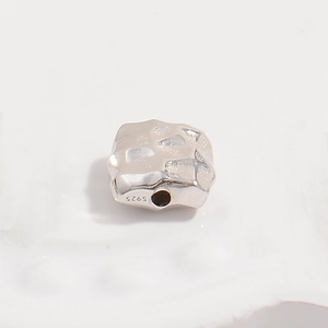 Macro shot of S925 sterling silver square hammered bead for DIY jewelry making