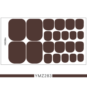 Macro shot of dark brown solid color 3D toenail stickers with YMZ283 model code