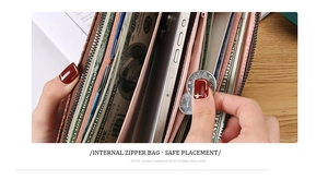Macro detail of long wallet with pink leather interior and secure zipper pocket