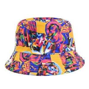 Close-up of yellow graffiti bucket hat showing detailed twill fabric texture and colorful patterns