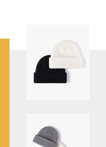 Vertical rib knit texture detail on black, white, and gray minimalist beanie hats