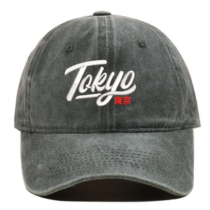 Macro detail of high-quality Tokyo 3D embroidery on vintage washed cotton baseball cap