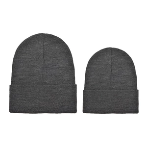 Detail of two dark grey knit beanies in large and small sizes for winter warmth
