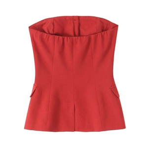 Detail of red tube top featuring tailored waist and side flap pockets on high quality fabric
