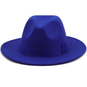 Detail of royal blue wool fedora hat featuring matching ribbon and wide brim design