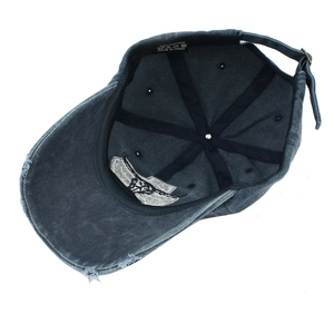 Detail view of the 100% cotton inner structure and sweatband of the navy baseball cap