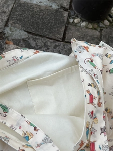Detail shot of canvas tote bag interior with inner pocket and cute cartoon dog prints