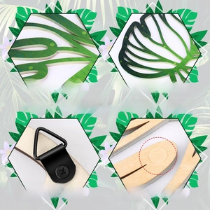 Detail of wooden tropical leaf wall art showing thick hollow design and back metal hook