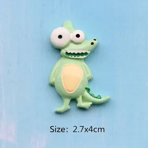 Close-up of a 2.7x4cm green resin cartoon crocodile charm for DIY crafts and magnets