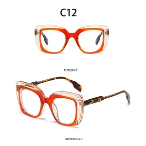 Detailansicht der quadratischen Brille mit orangefarbenen Schichten und Schildpattbügeln