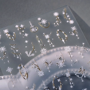 5D embossed Christmas snowflake nail stickers with elegant white and gold star patterns