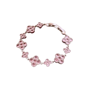 Pink zircon four-leaf flower clover bracelet in gold metal finish with secure buckle