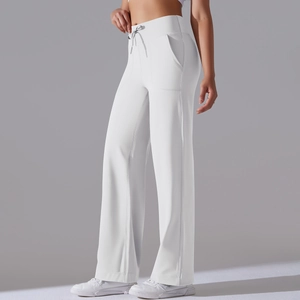 Close-up of white high-waist yoga wide-leg pants featuring drawstring and side pockets