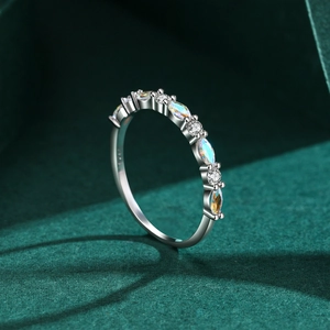 Elegant s925 silver stacking ring featuring multi-color marquise gemstones on dark green