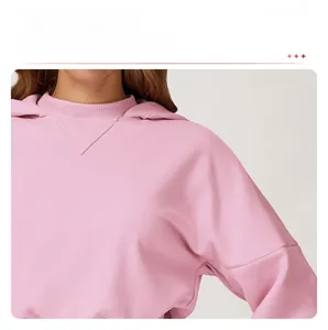 Close-up of pink hoodie with drop shoulder design and premium ribbed knit texture details