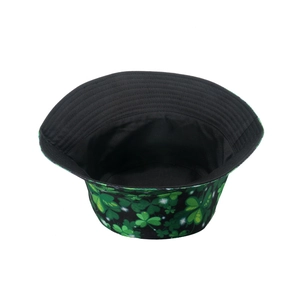 Green shamrock bucket hat for women with all-over clover pattern and black lining