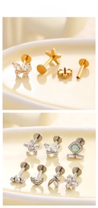 Detail der Labret-Stecker mit Zirkon-Schmetterling und Mond in Gold- und Silberoptik