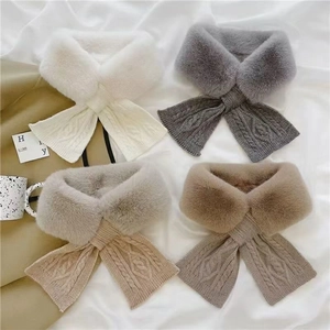 Detailed view of knitted faux fur scarves in four colors with textured cable pattern