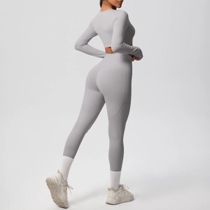 Detail of grey yoga set showing functional side pocket and high-stretch fabric texture