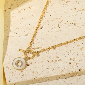 Elegant gold necklace with toggle clasp and mother of pearl pendant with micro-set crystals