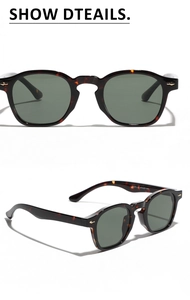 Detail view of tortoiseshell frame sunglasses with gold accents and green lenses