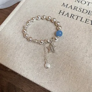 Minimalist silver beaded star flower elastic bracelet with shiny metallic finish