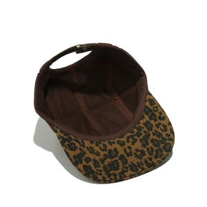 Detail of internal lining and adjustable metal buckle on leopard print camper cap