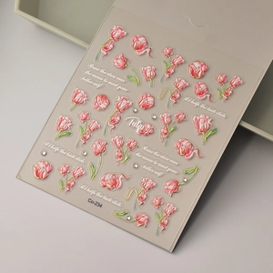 Macro view of 3D embossed pink tulip nail stickers with elegant gold foil accents