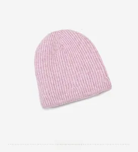 Detail view of pink ribbed knit beanie showing high-quality wool texture and soft fibers