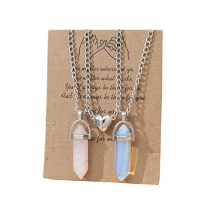 Magnetic hexagonal crystal pillar couples necklace with heart pendant on display card