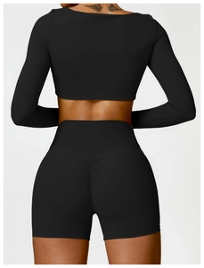 Rear view of black long sleeve yoga set showing push up shorts with scrunch detail