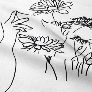 Close-up of minimalist line art wildflower print on premium soft polyester fabric tapestry