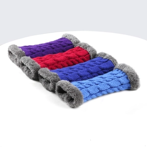 Flat lay of knit fingerless gloves with plush cuffs in purple, red, and blue tones
