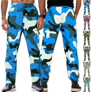 Detail view of camouflage cargo pants featuring elastic drawstring waist and side pockets