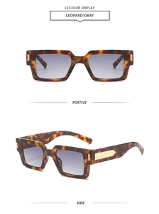 Detail view of leopard frame sunglasses with gray gradient lenses and metal hinges