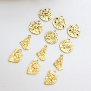 Gold plated vintage irregular pendants with embossed figures and colored zircon stones