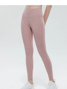 Detail of high-waist peach lift yoga pants in dusty pink showing seamless fabric texture