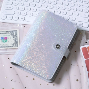 Flat lay of laser silver PU leather A6 binder with metallic snap and mesh background