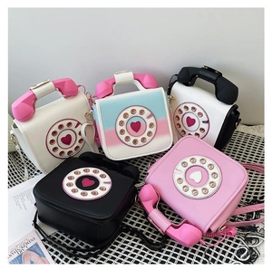 A collection of creative vintage telephone shaped handbags in various colorful PU leather styles