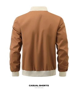 Back view of a brown men's bomber jacket with cream ribbed cuffs and functional sleeve pocket