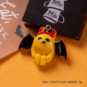 Detailed close-up of a resin pumpkin devil ghost pendant for DIY Halloween jewelry