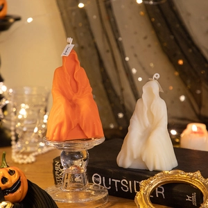 Ghost robe skull scented candles in orange and white for Halloween decor