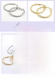 Detail of twisted hoop earrings in gold and silver finish made of durable titanium steel